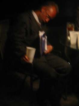 businessman passed out holding a 2/3rds empty cup, didn't spill a drop